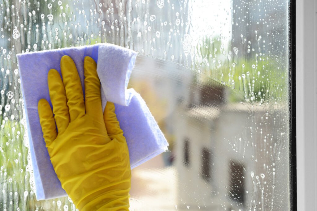 hand cleaning window