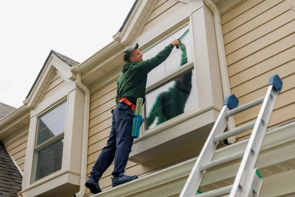 professional window cleaning service on a roof
